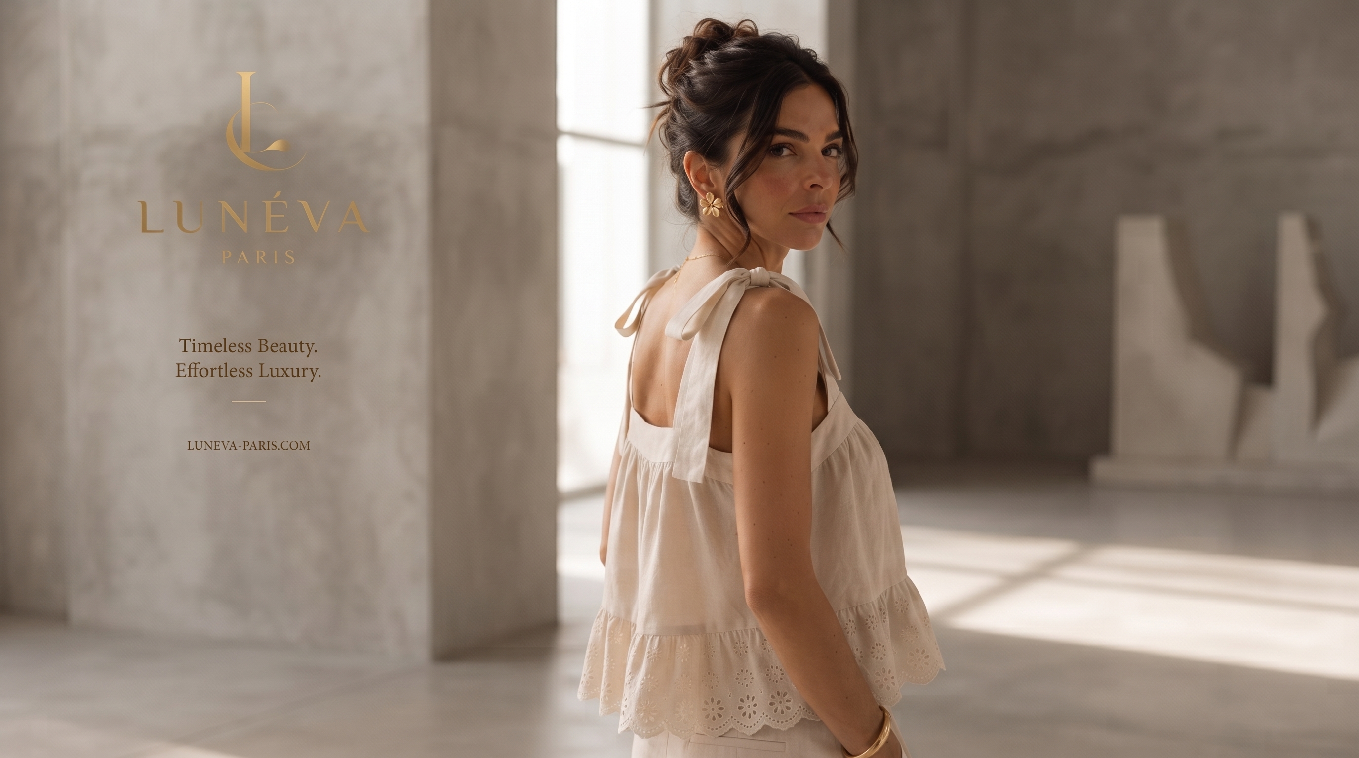 Back view of the cream top showing the tied shoulder bow construction